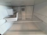 GE 21.9 Cu. Ft. Top-Freezer Refrigerator in Black - Image 3